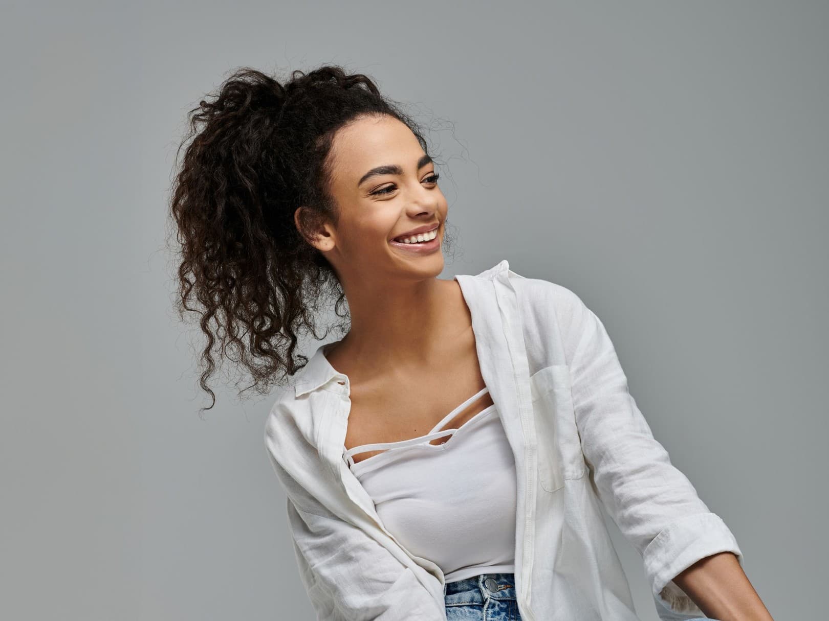 Smiling woman in a white shirt